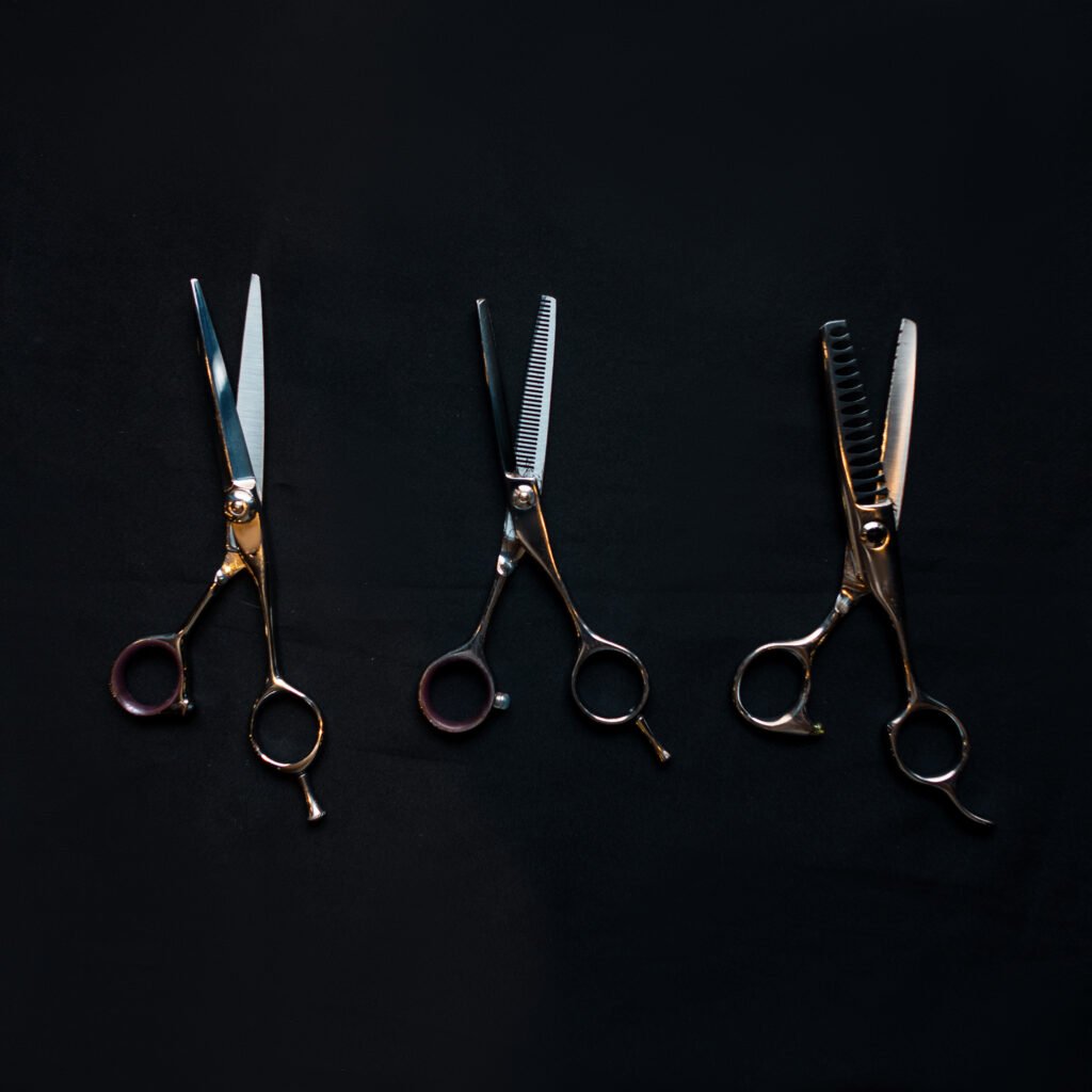 vintage tools of the hairdresser on a black background indoors.